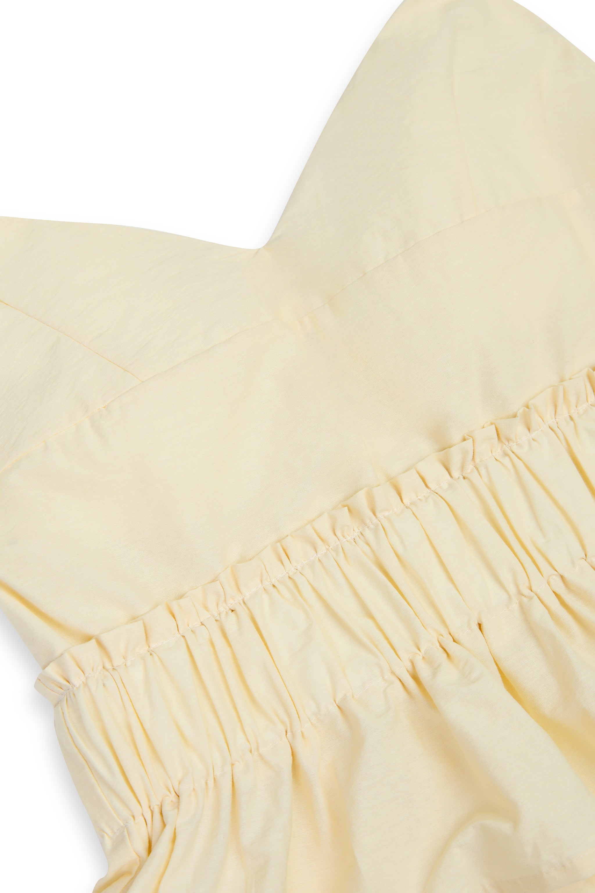 Poppy V-neck Padded Peplum Top in Yellow Creme