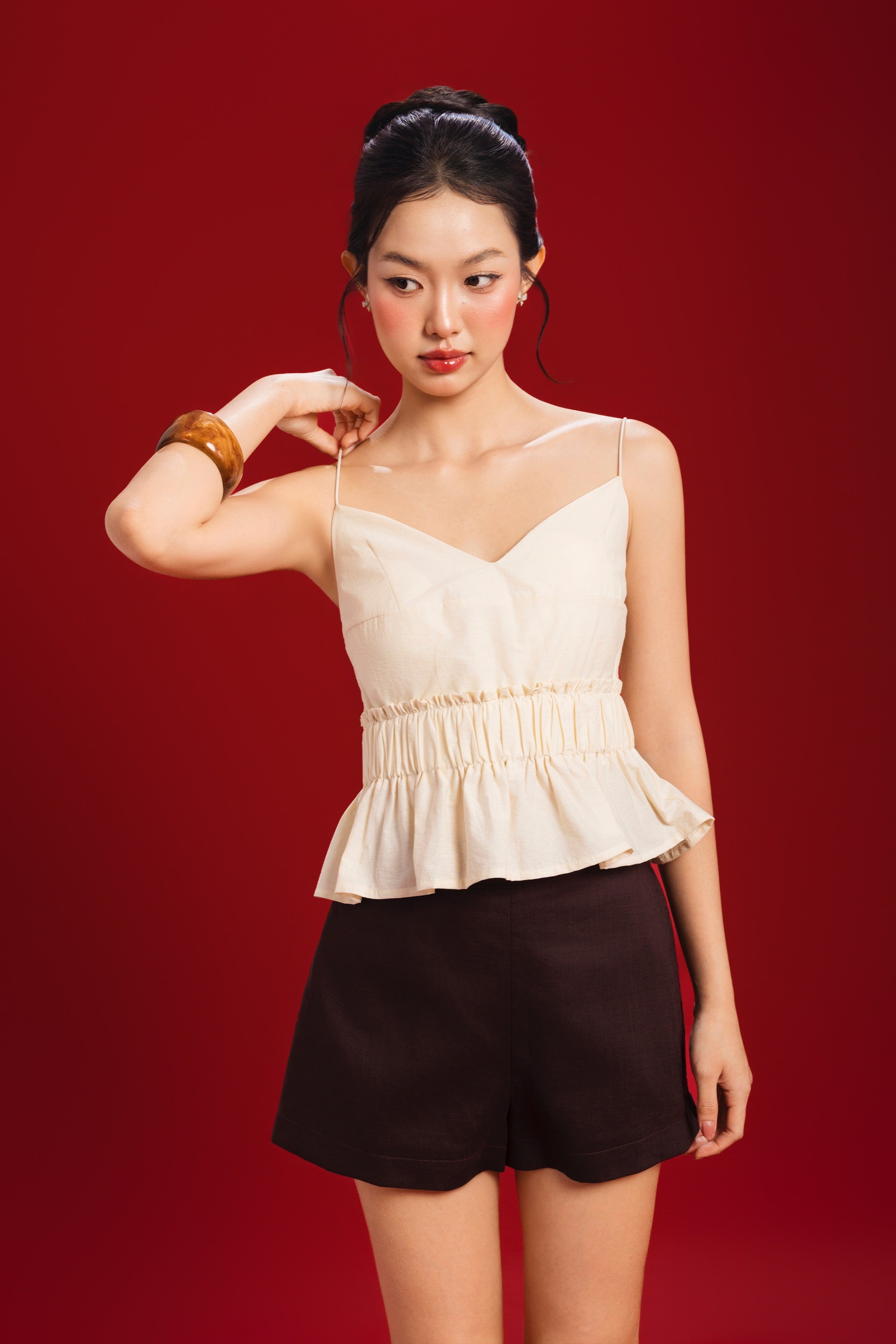 Poppy V-neck Padded Peplum Top in Yellow Creme